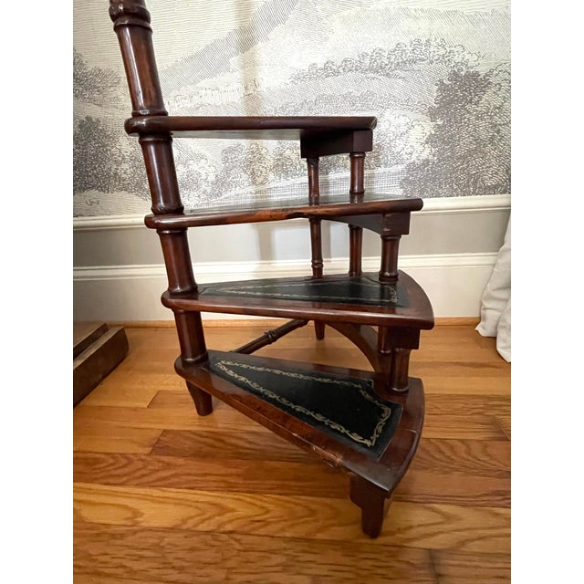 A beautiful antique English Mahogany library step stool / staircase, consisting of four steps with each step lined with a...