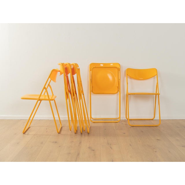 Timeless Ted folding chairs by Niels Gammelgaard for IKEA from the 1970s in yellow. High-quality metal frame with plastic...