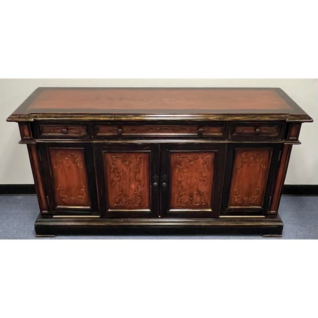 Wonderful rustic European style sideboard credenza from Artistica Home. Features a red and black japanned finish with hand...