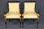 This impressive suite of twelve ebonized and parcel-gilt dining chairs, comprising ten side chairs and two armchairs, is a...