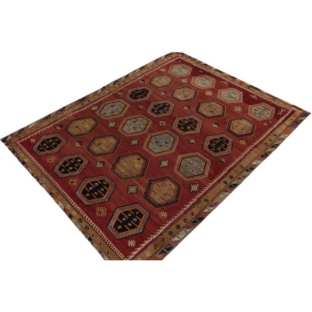 Originating between 1950-1960, a rare 8x11 vintage kilim rug believed to hail from mid-century Anatolia in Turkey....