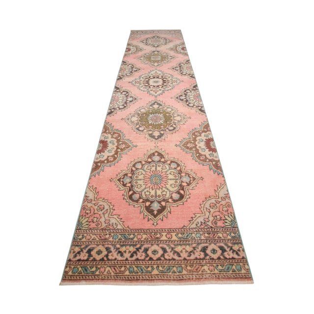 Woven in the 1970s by women's cooperatives in the Sille district of Anatolia, this exquisite hand-knotted runner rug...