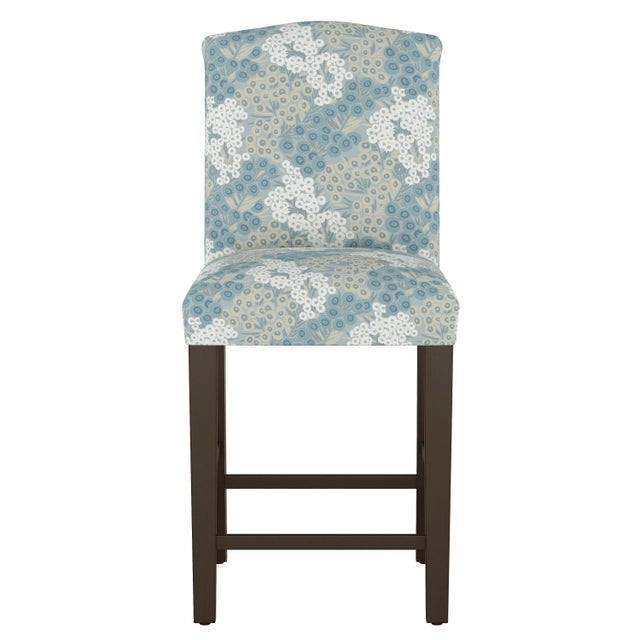 Dip just a toe outside of tradition with this uniquely shaped counter height dining chair, hand upholstered in a rich...