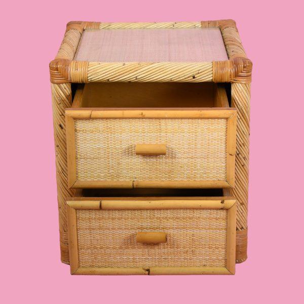 Charming vintage nightstand attributed to Bielecky Brothers, crafted from twisted rattan with woven cane drawer fronts....