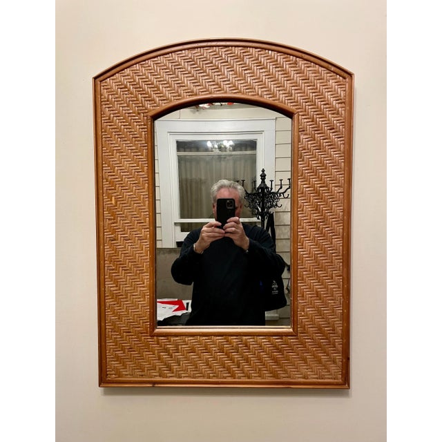 Woven Rattan Arch top mirror with wood frame and back. Measures 29.5" x 21.5" wide. Mirror itself is 19.5" x 12" wide....