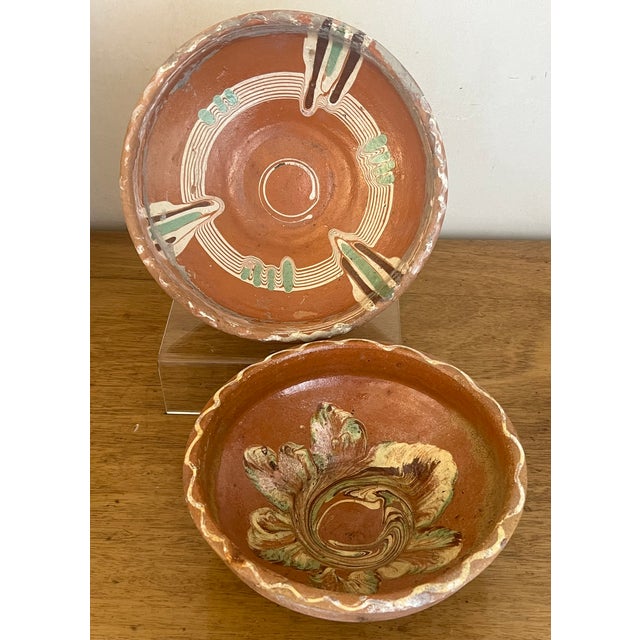 Set of two rustic style earthenware bowls made in Hungry in the mid 20th century. The bowls are hand turned and painted....