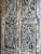 1920s Distressed Hand-Carved Wooden Barn Door With Metal Studs – Vintage Rustic Statement Door 84x36 For Sale - Image 5 of 6