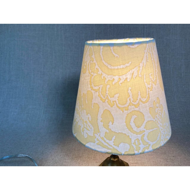 A pair of lampshades handmade with Fortuny’s iconic printed cotton, measurements: top5” side 7.5 bottom 8”