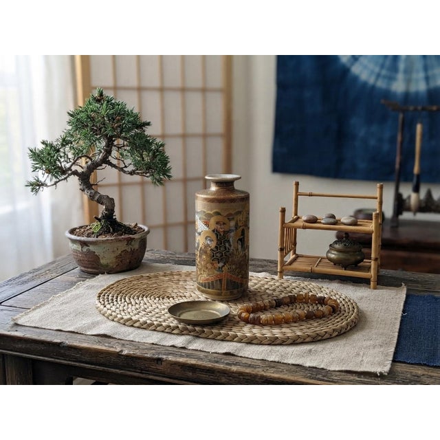This exquisite 4.75" tall Japanese Satsuma-style cylindrical vase features intricate moriage detailing and rich gilt...
