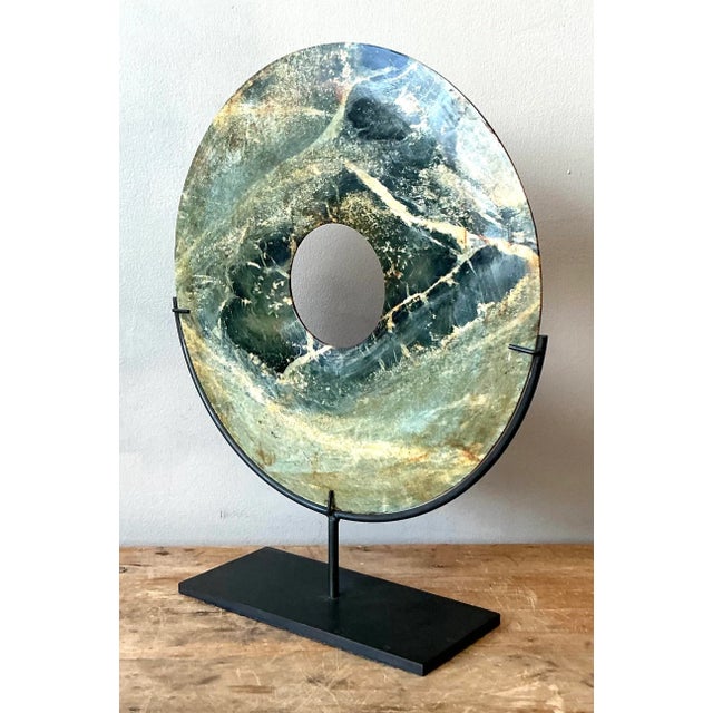 Presenting a captivating vintage Asian green marble bi disk, a striking decorative object that brings natural elegance and...