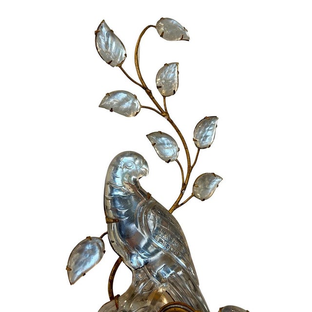 A pair of Maison Baguès wall sconces with their iconic parrot and urn design. The parrots are traditionally paired as they...