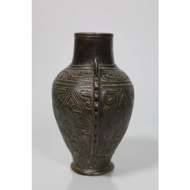 Bronze ceremonial vase, Ming Dynasty (1368-1644) - China. Decorated with Taotie masks in the style of archaic Shang...