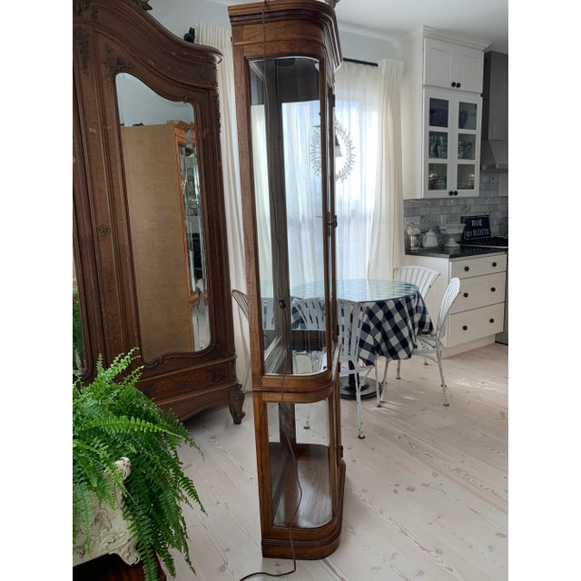 Here we have a vintage Pulaski lighted glass curio cabinet. Gorgeous French Empire style with two beveled glass doors,...