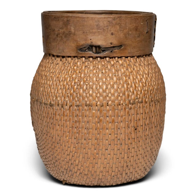 Centuries ago, a woven reed fisherman’s basket such as this would have been common in rural China as an everyday item,...