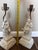 Beautiful complementary pair of vintage Arnart Creations porcelain table lamps, featuring finely detailed neoclassical...