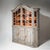 Two-part kitchen cupboard with a glazed upper section and a closed lower cabinet. The shaped cornice and finely divided...