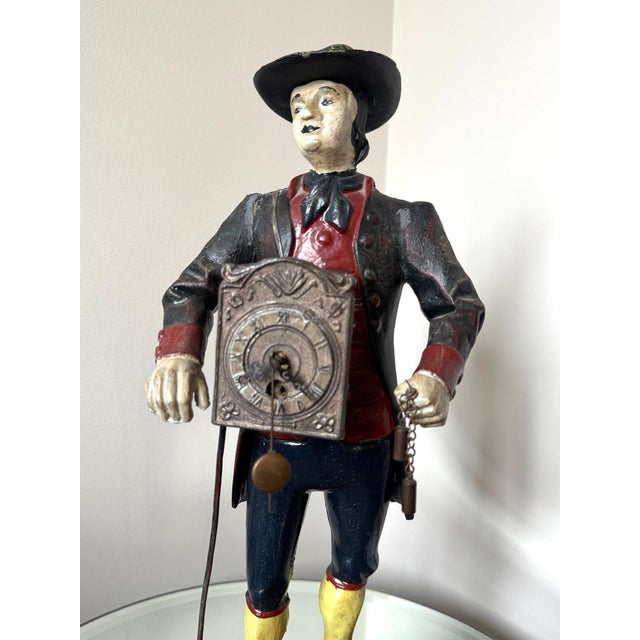 Antique Style Painted Cast Iron Dutch Peddler Clock Figure Folk Art Uhrenträger Mantelpiece Decor This exceptionally...