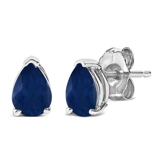 Envision the allure of glimmering sapphire isles each time you adorn these exquisite solitaire stud earrings, featuring...