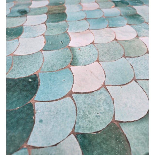 Beautiful handcrafted Moroccan mosaic table featuring an elegant emerald green color palette. Measuring 48 inches in...
