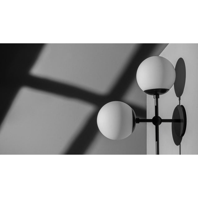 Gravity-defying playfulness requires technical precision. Suggestive minimalism of connective nodes creates a grid-like...
