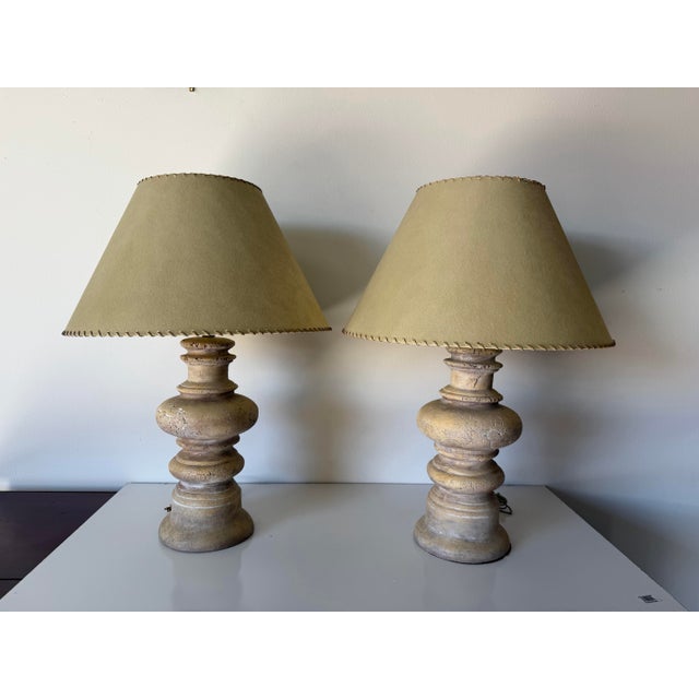Beautiful pair of 1980s vintage handmade terracotta table lamps featuring an organic, sculptural silhouette with a warm...