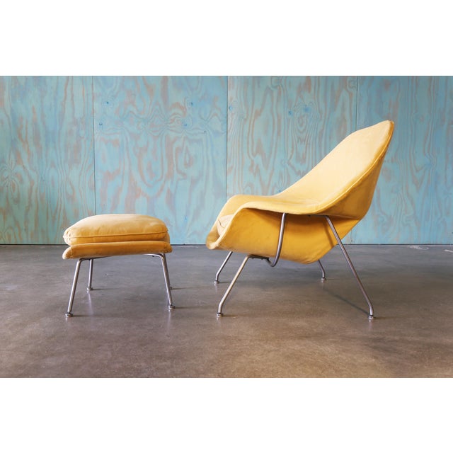 A 1960's yellow Knoll womb chair and ottoman designed by Eero Saarinen for Knoll. Reupholstered in the 1990s in a yellow...