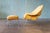 A 1960's yellow Knoll womb chair and ottoman designed by Eero Saarinen for Knoll. Reupholstered in the 1990s in a yellow...