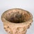 A substantial garden basin in reconstituted stone with a terracotta patina, adorned with a rich decoration of sculpted...