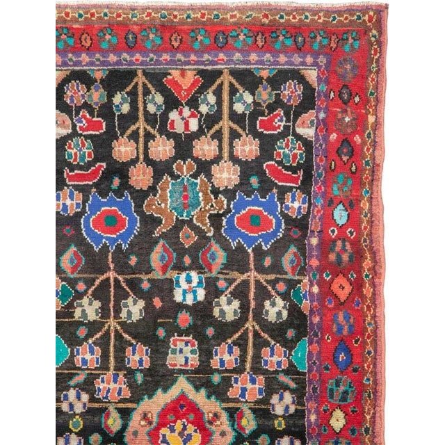 A vintage Persian hamadan rug from the mid-20th century. Hamadan town and the surrounding weaving area of about 120...