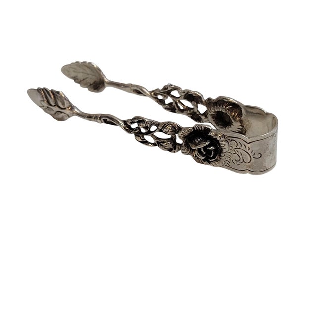 This Hildesheimer Rose sugar tong is an example of mid-20th-century German silversmithing, showcasing one of Europe’s most...