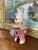 This vintage wind-up bunny rabbit toy dates to the mid-20th century, likely from the 1950s-1960s. The toy features a...