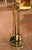 Elegant in its restrained neoclassical styling, this vintage fireplace tool set combines polished brass with blackened...
