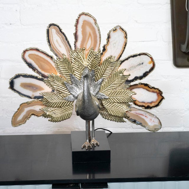Lit brass and cut agate peacock sculpture in the style of Willy Daro.