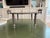 Hollywood Regency Vintage Moroccan Chased Silver-Tone Footed Tray Table With Glass Top & Turned Finial Legs For Sale - Image 3 of 4