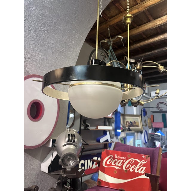 "Disco Volante" chandelier - Stilnovo, Milan - 1960s Iconic hanging chandelier model "Disco Volante," designed and...