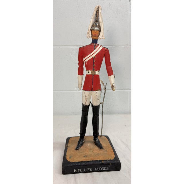 This antique 19th century H.M. British Life Guard troop hand carved wooden sculpture is a unique and exquisite piece of...