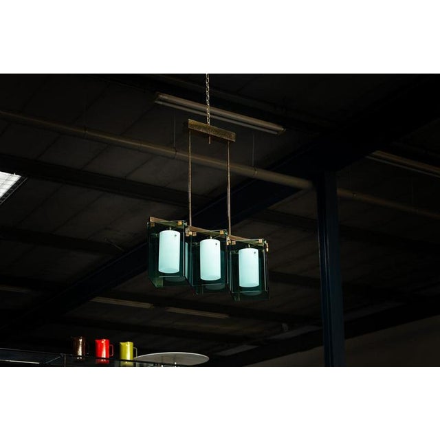 Rare model 2128 chandelier designed by Max Ingrand and manufactured by Fontana Arte in Italy, 1960. This striking...