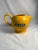 An iconic pitcher that makes you harken back to an era when French bistros/cafes/bars served beverages in this cheery-...