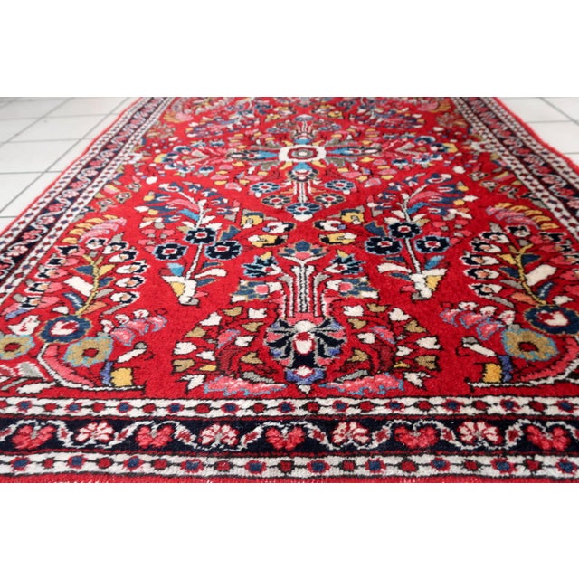 Elevate your space with our exquisite Handmade Vintage Oriental Sarouk Rug. Originating from the Middle East and crafted...