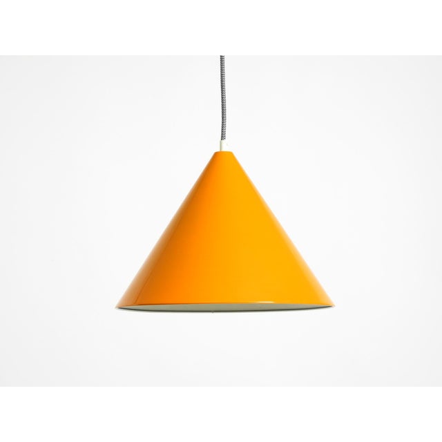 Original 1970s orange metal pendant lamp, model "billiard." manufacturer: louis poulsen. Made in denmark. Features the...