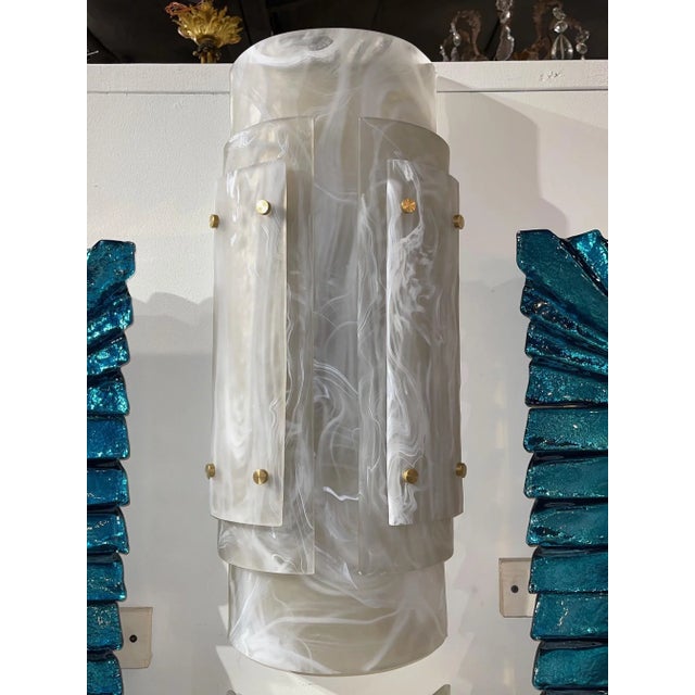 Very fine large scale Murano glass and brass sconces. The glass on this pair has a lot of movement and depth. True works...