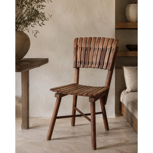 An unusual mid-century wooden side chair made in Yugoslavia, dating to approximately the late 1950s or early 1960s....