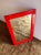 Exceptionally rare modern vanity mirron in bright red that perfectly embodies the warm colours, soft lines, and...