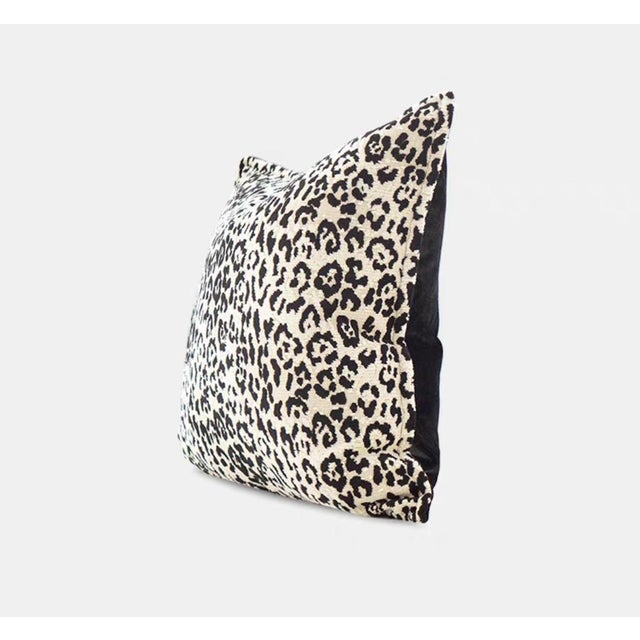 This 21-inch square throw pillow features a visually striking leopard print - the deep and light spots are like ink...
