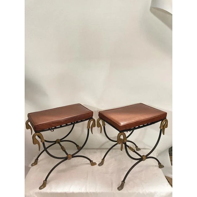 Rare pair of swan neck stools attributed to the Maison Jansen / leather cushions This piece is attributed to the mentioned...