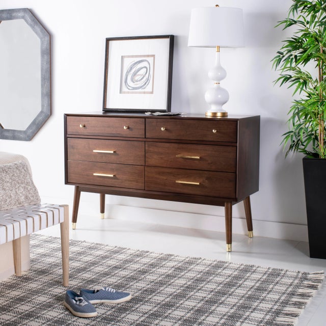The mod style and character of this retro dresser updates any bedroom. Crafted with a walnut wood veneer, it's...