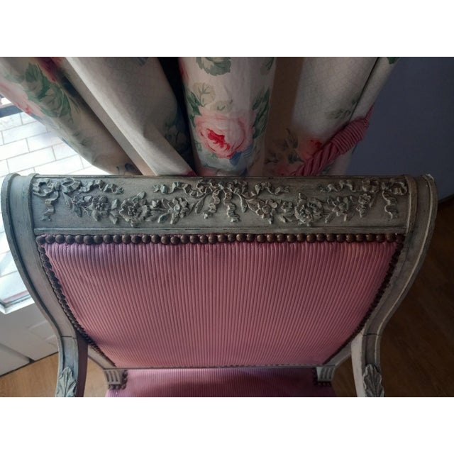 Elegant pair of Louis XVI style armchairs from the Napoleon III period. Round section fluted sheathed feet. Garlands of...