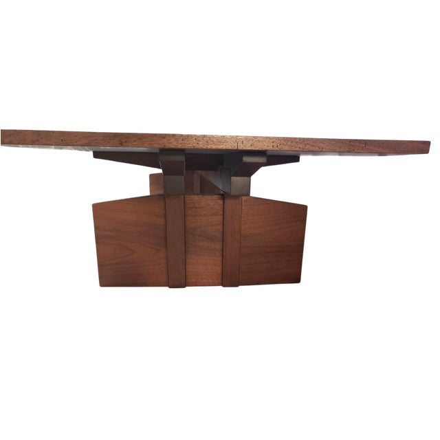 A truly stunning and significant solid black walnut coffee table. If you have the space for an understated statement, this...