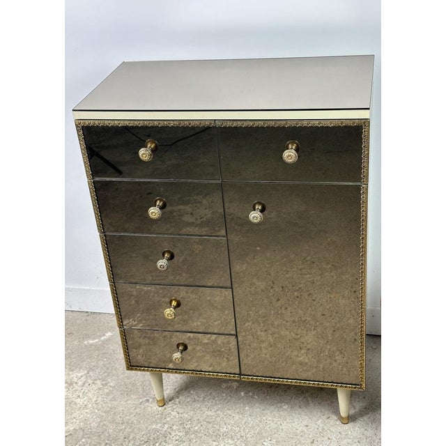 Italian vintage mirrored glass chest of drawers 1960, scalloped gallery and brass handles. 6 drawers and 1 door. mirrored...
