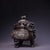 A commanding Chinese lidded censer cast in patinated bronze, finished with silver-washed high-relief chasing across the...